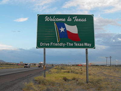 welcome to texas sign on the highway