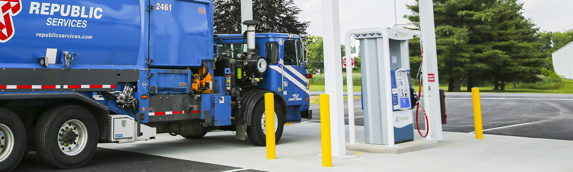 Photo of waste trucks at a Trillium station fueling